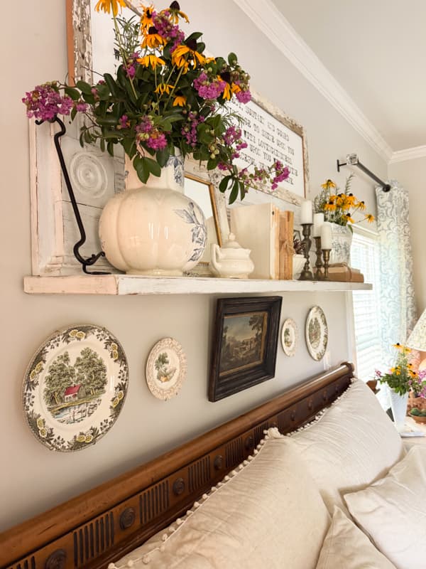 repurposed mantel with transferware dishes underneath