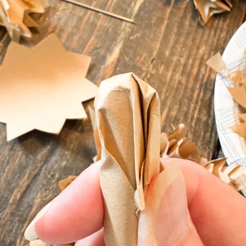 press craft paper around handle to shape