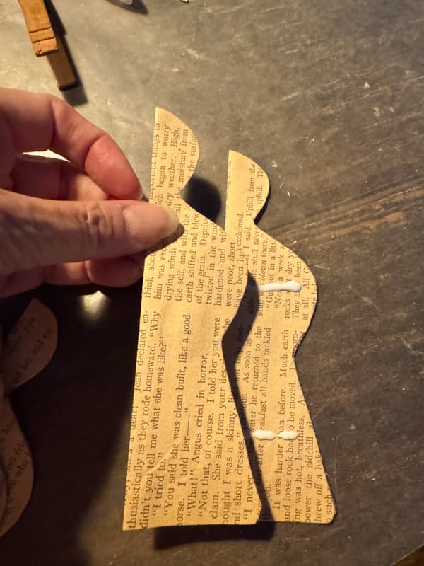 Stack paper angels evenly.