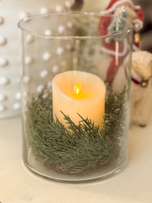 large glass vase with candlering and flicker candle