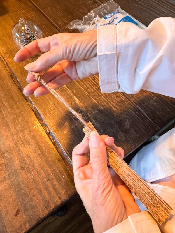 adding hanger to old book page paper angel