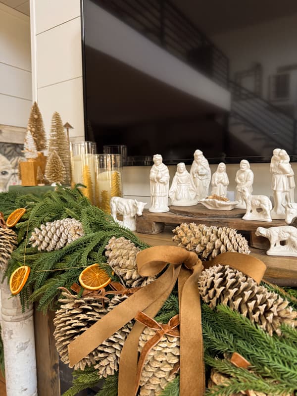 Christmas Mantel With Nativity Scene and Pinecones