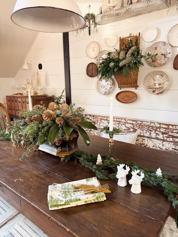 table runner garland with deer salt and pepper shakers and centerpiece