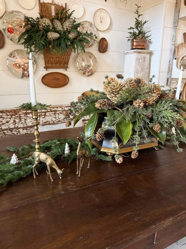 Dining table Christmas centerpiece with vintage brass deers.