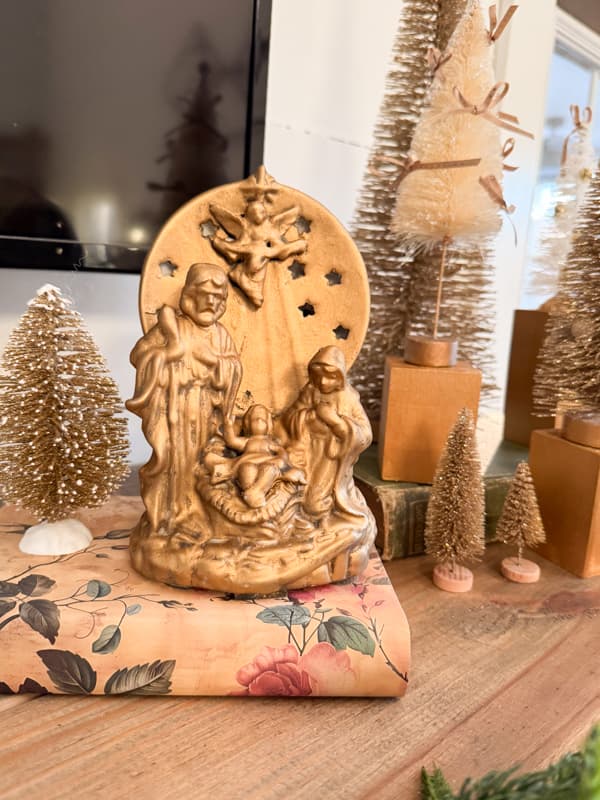 Gold leaf nativity scene tea light candleholder on mantel
