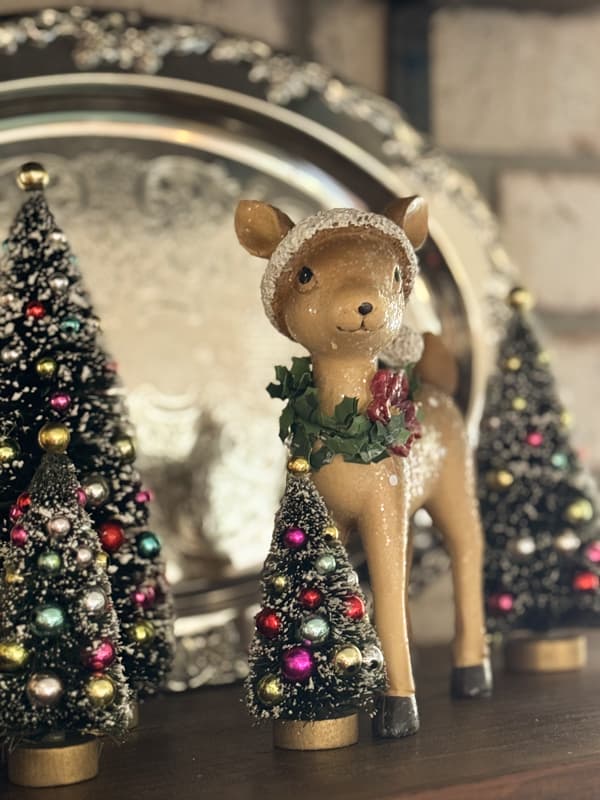 vintage reindeer with bottle brush trees and vintage silver tray on open shelves in kitchen for Christmas tour