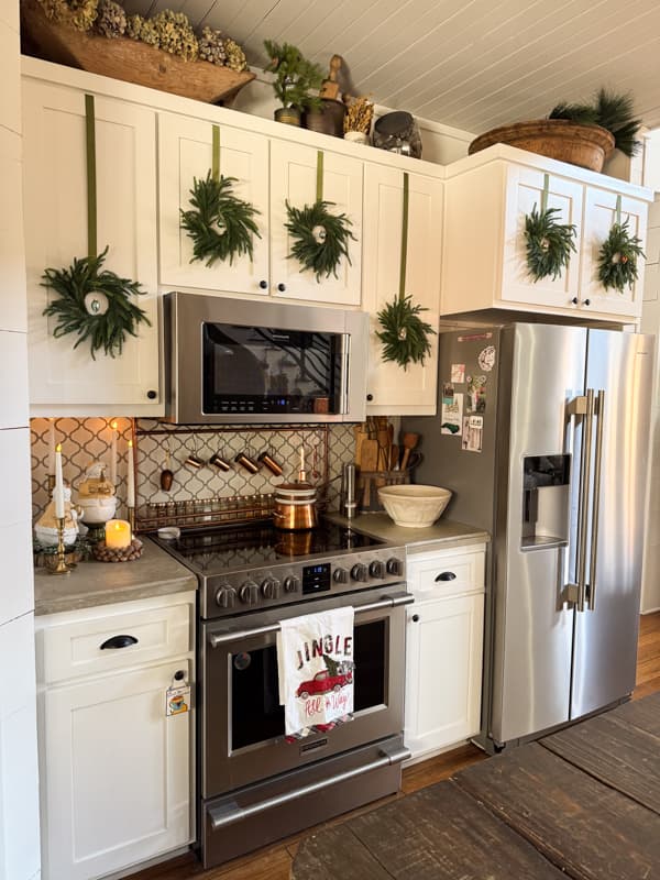 Wreaths on Kitchen cabinet doors for 2025 Christmas tour