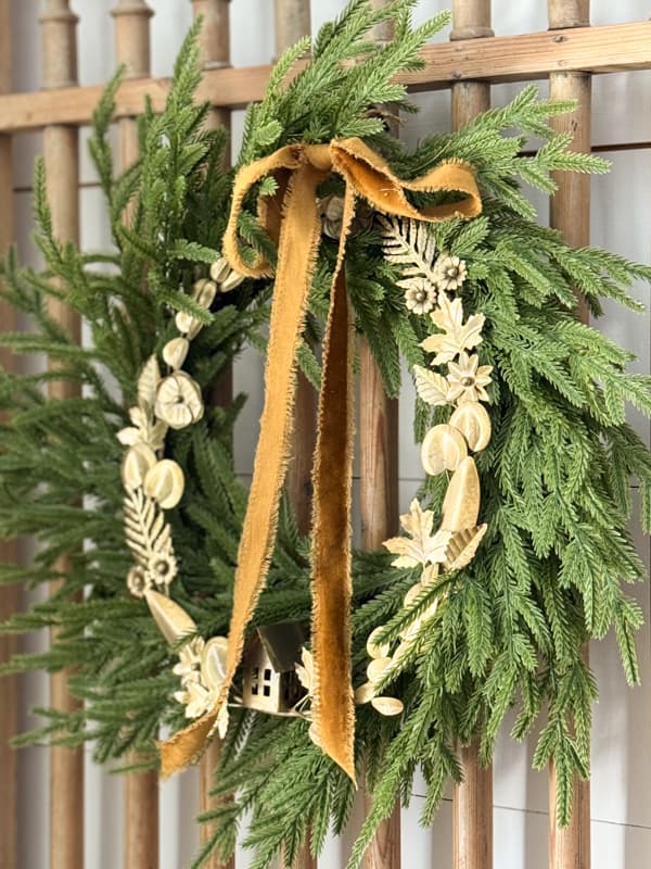 Norfolk Pine Wreath with Christmas Wreathh and Caramel colored bow