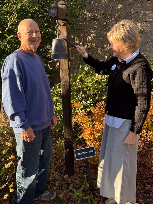Brad with Rachel as she rings the bell