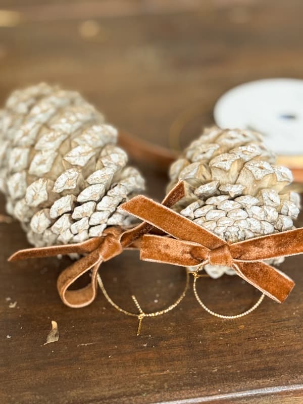 Tie a Bow With Ribbon to each eye hook 