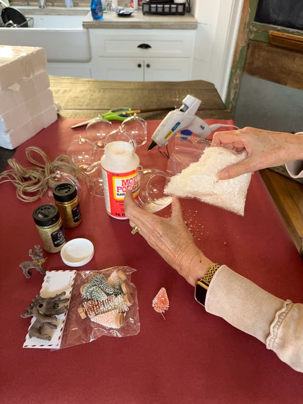 add faux snow to mod podge