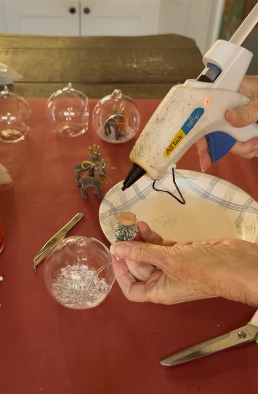 hot glue to bottom of bottle brush tree