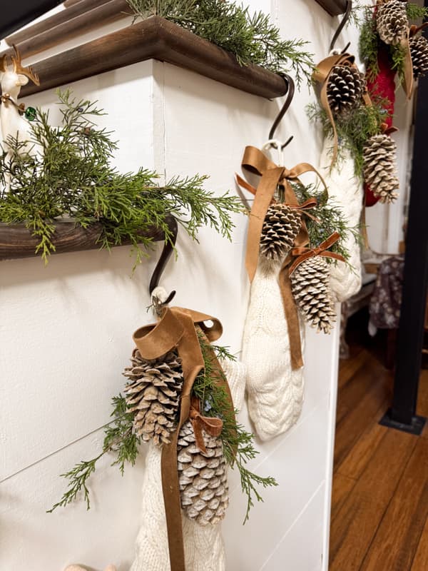 added greenery above each pinecone enhanced Christmas Stocking