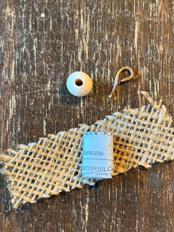 burlap,paper, bead and wire for replacement baby Jesus