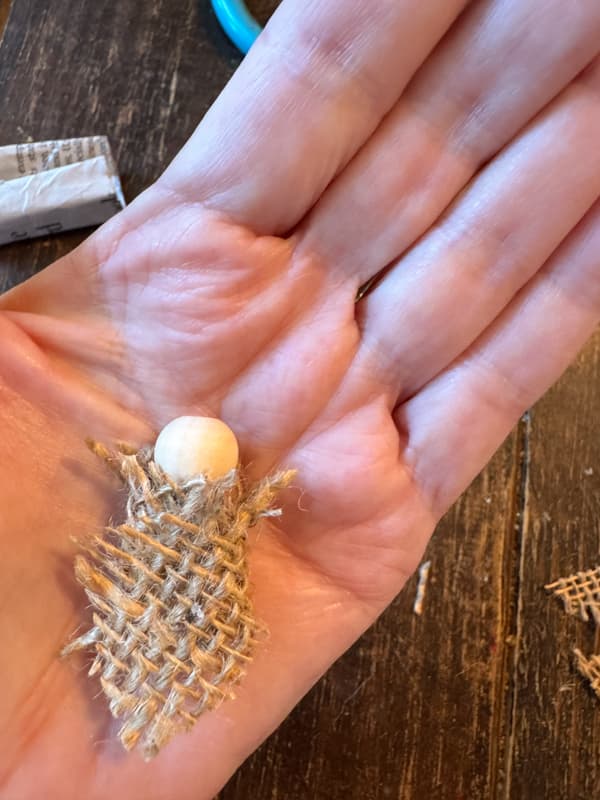 burlap wrapped baby Jesus with bead for head