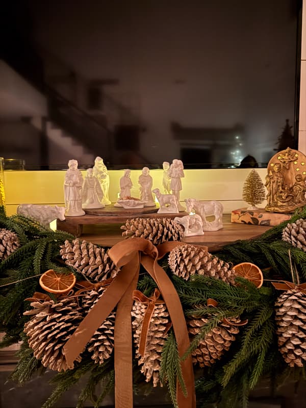 candlelight view of nativity scene on mantel