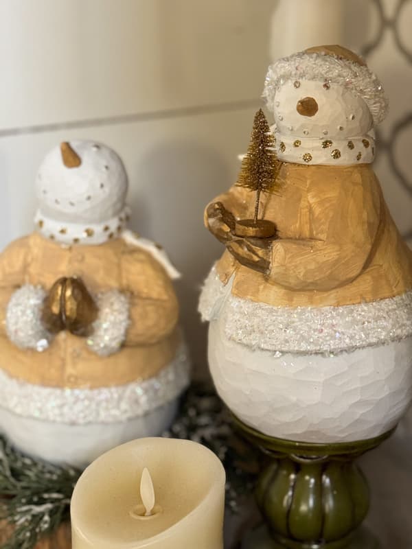 close up of two thrift store DIY snowmen