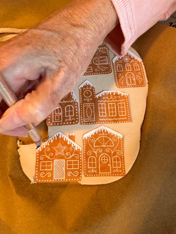 cut around gingerbread house designs with exacto knife
