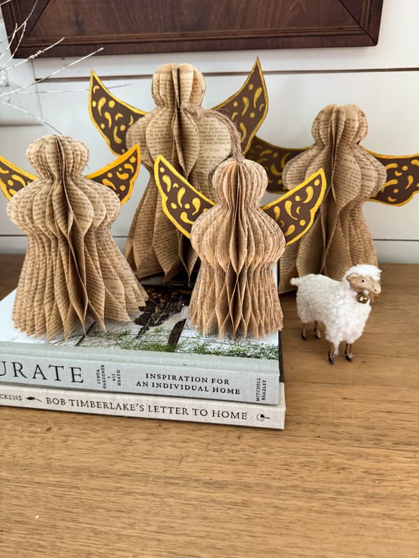 different size old book page paper angels without glitter.