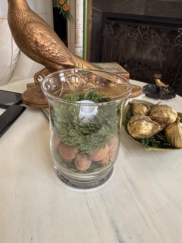 Greenery ring with nuts and candleholder with tea light