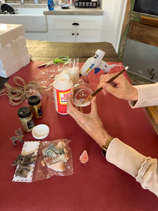 Paint bottom inside of the glass globe