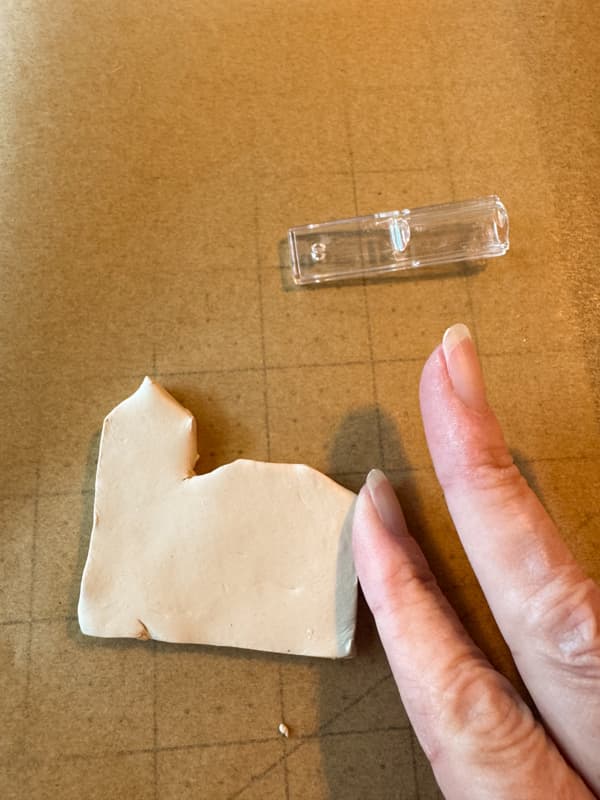 smooth the edges of the clay with damp fingers.