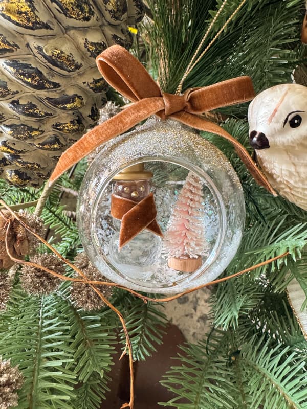 snowman snowglobe ornament on Christmas tree