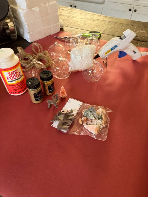 supplies for DIY reindeer Snow Globe ornaments