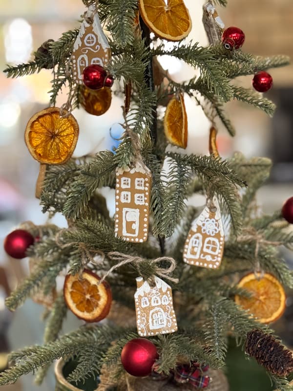 tie  gingerbread house ornaments to tree with jute twine.