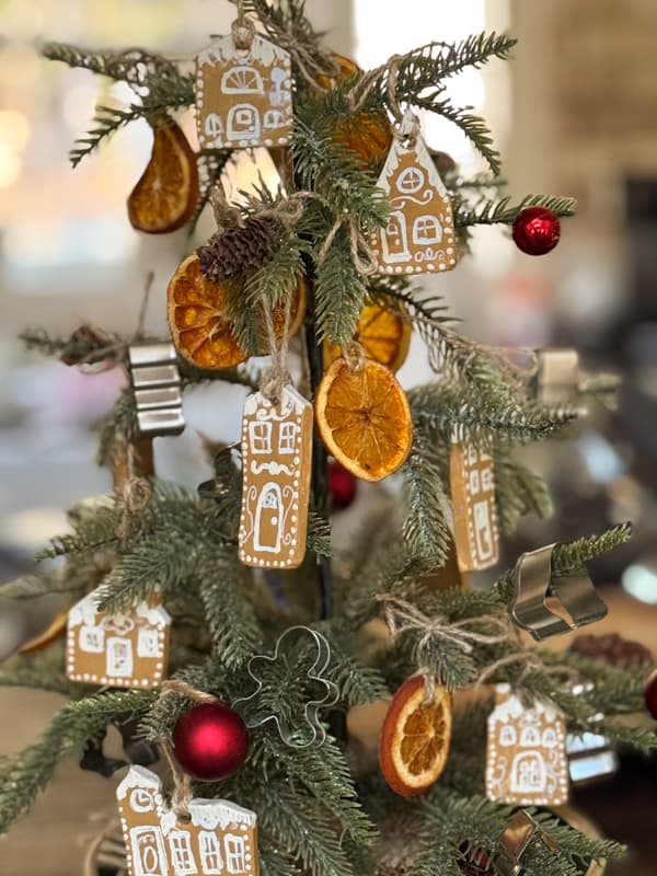 tie  gingerbread house ornaments to tree with jute twine.