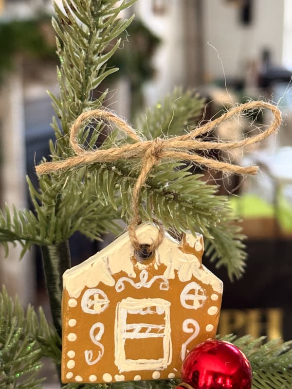 tie  gingerbread house ornaments to tree with jute twine.