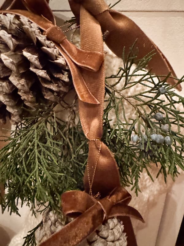 tie the pinecone onto the ribbon 