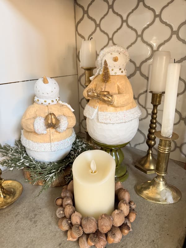 upcycled snowmen surrounded by candles