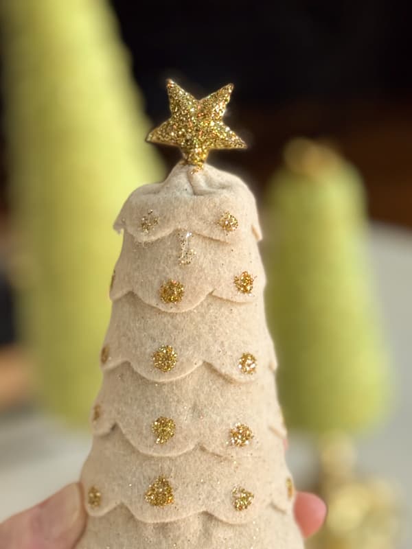 Add glitter to star on top of Felt trees