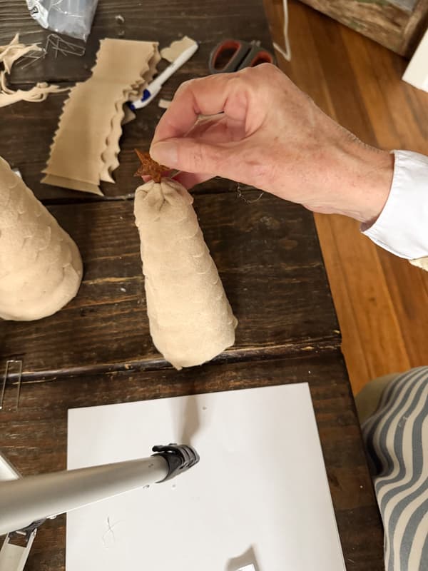 Finish top of tree with a metal star