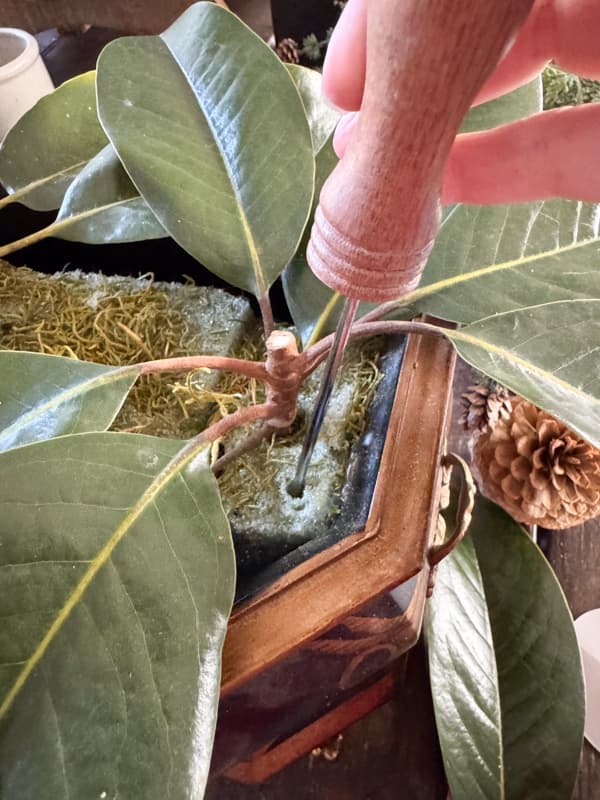 Use ice pick to create hole in styrofoam 