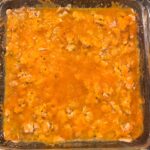 Cooked Broccoli Casserole with cheesy top.