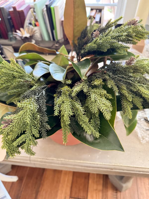 adding faux stems to drape over the real magnolias