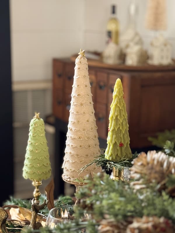 Felt Christmas trees on thrifted brass candlesticks