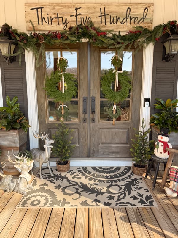 front doors with wreath, planters with greenery and garland for a Simple Christmas Porch