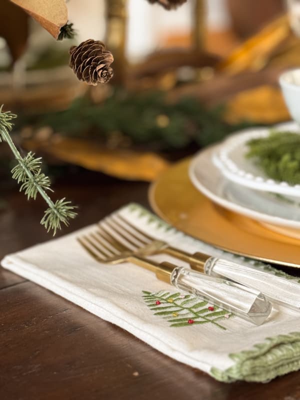 napkin with tree and gold acrylic flatware