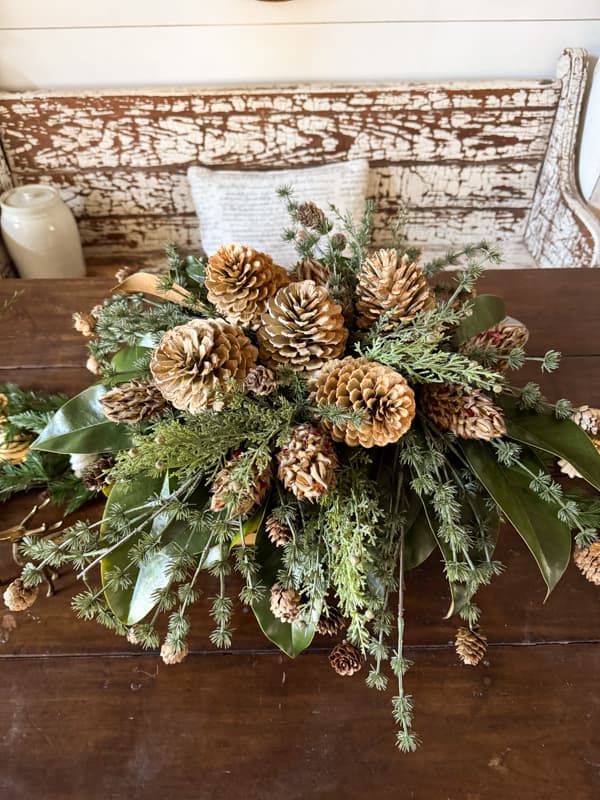 flat lay view of the pinecone and greenery centerpiece arrangement