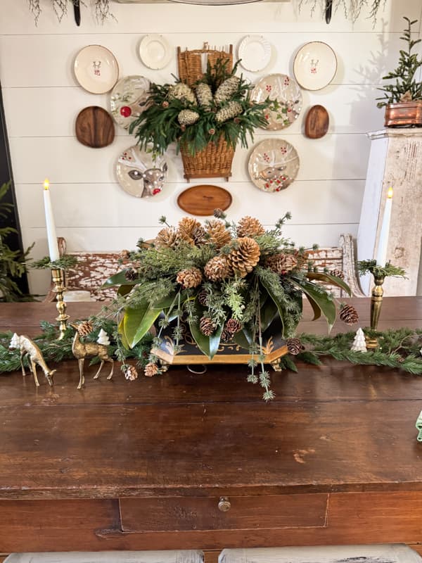 Pinecone Christmas Centerpiece with Gallery Wall Basket filled with faux pinecones and greenery