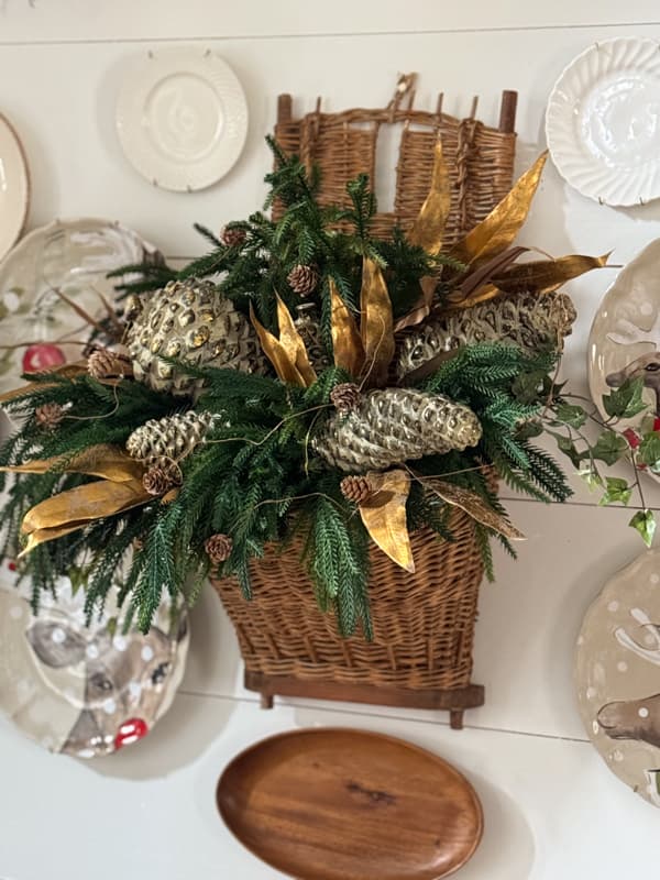 European Gathering Basket filled with faux stems and pinecones