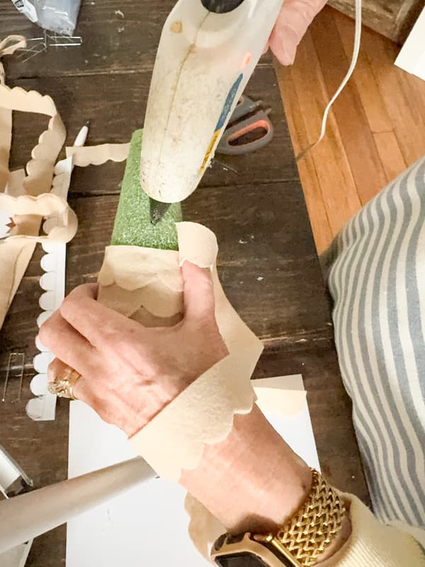 add hot glue as you overlap the fabric to create a felt Christmas Tree