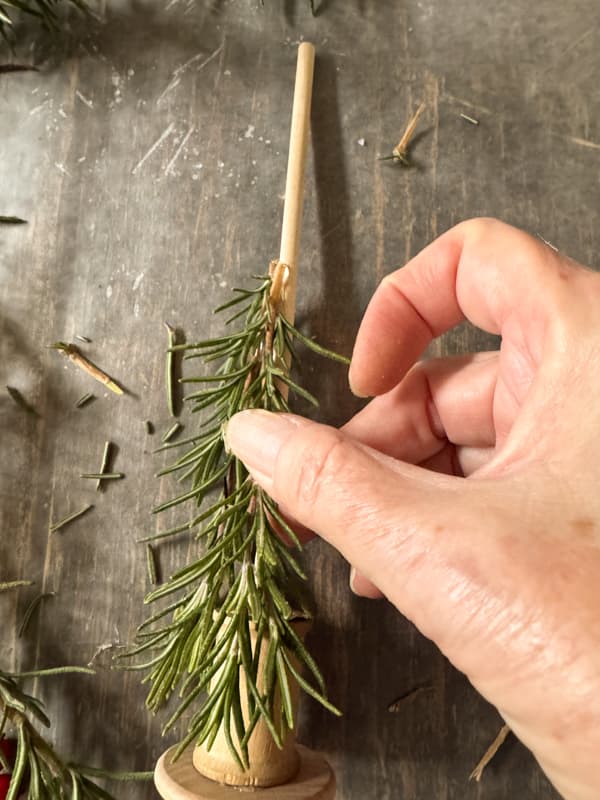 adding stems around the dowel rod