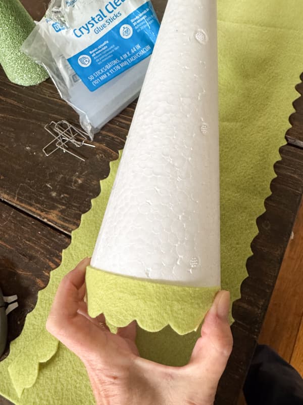 Add felt strips beginning at the bottom of the cone. 