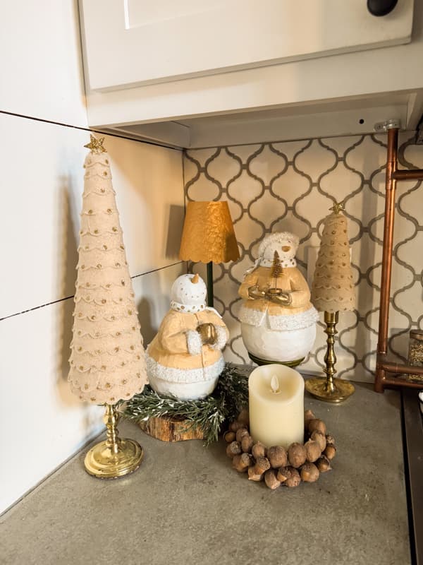 beige felt Christmas trees with repurposed snowmen