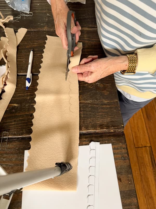 Cut the scallop design from the felt fabric to make Christmas Trees