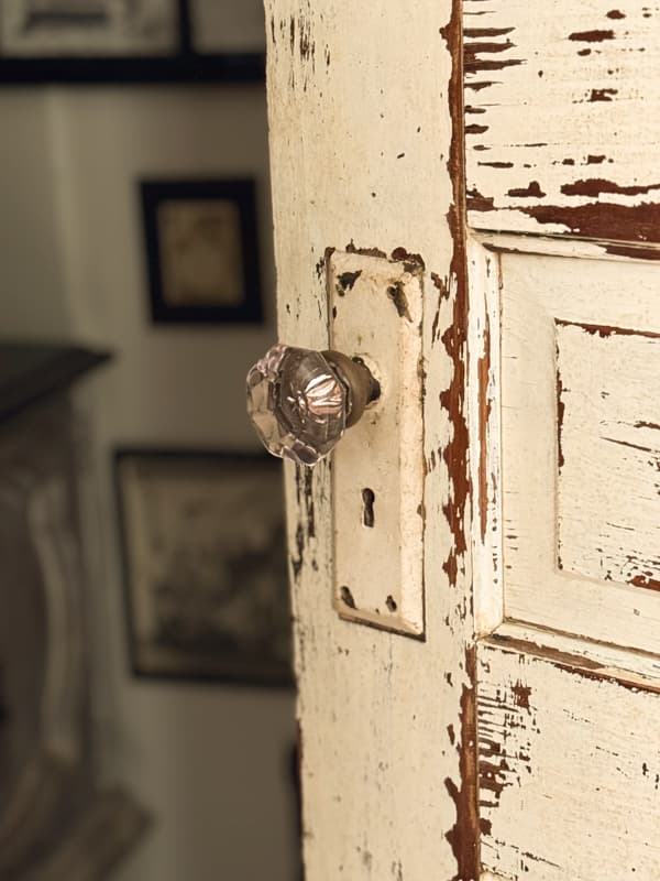 chippy paint old door with vintage glass door knob